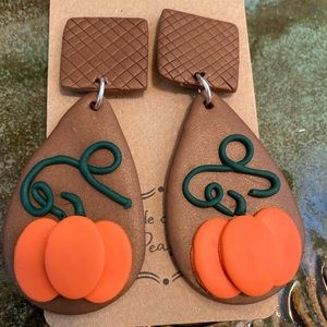 Fall pumpkin dangles with new twist in the colors. Lightweight polymer Clay.